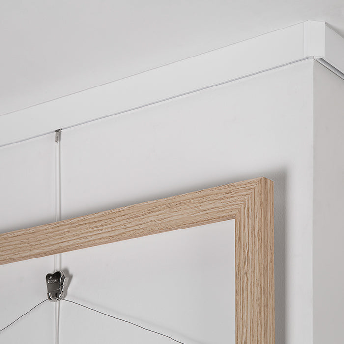 STAS Cliprail Max: riel para colgar cuadros con capacidad de 25 kg/m, estética impecable.